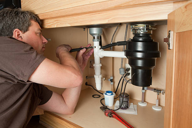Garbage Disposal Repair Pros technician performing garbage disposal service