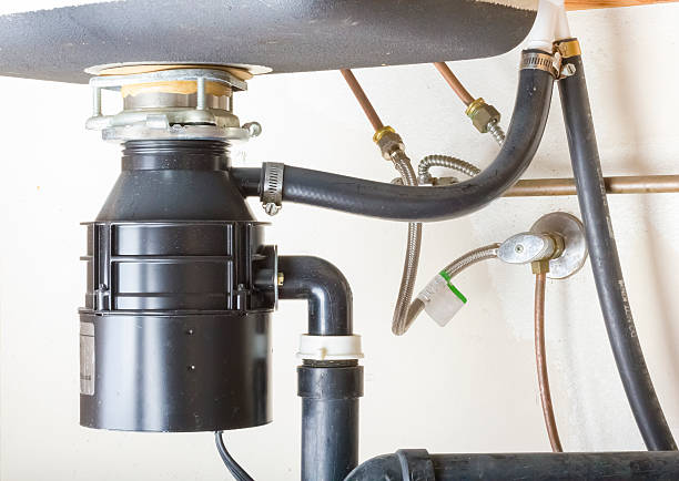 Garbage Disposal Repair Pros technician performing garbage disposal service